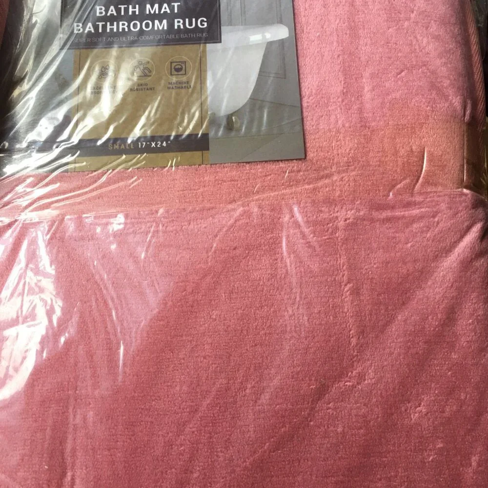 2 coral peach colored 17x24 bath mats. Matching Set - So Pretty